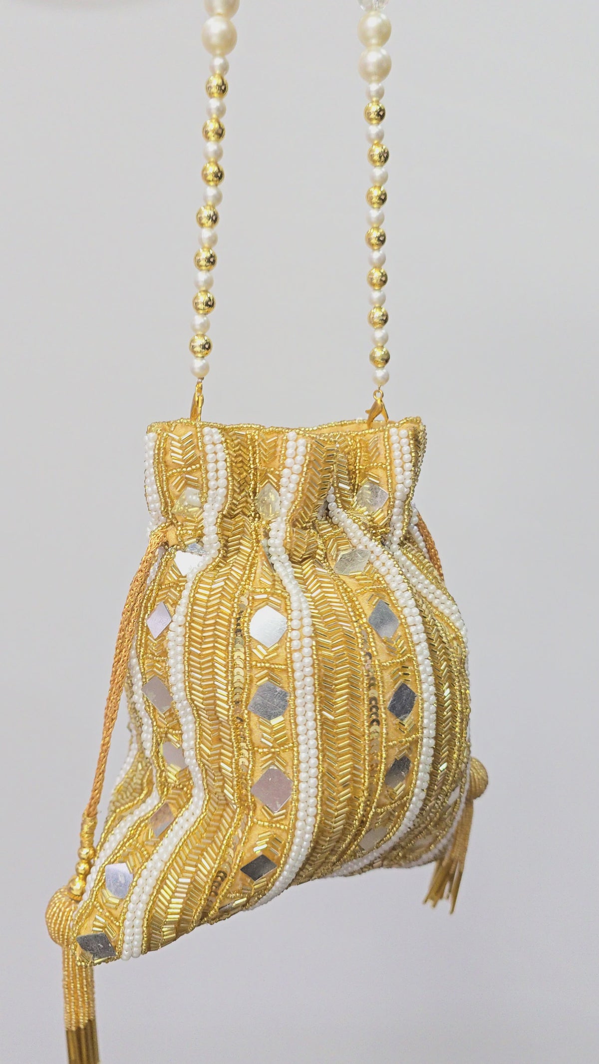 Gold pearl hand work potli bag