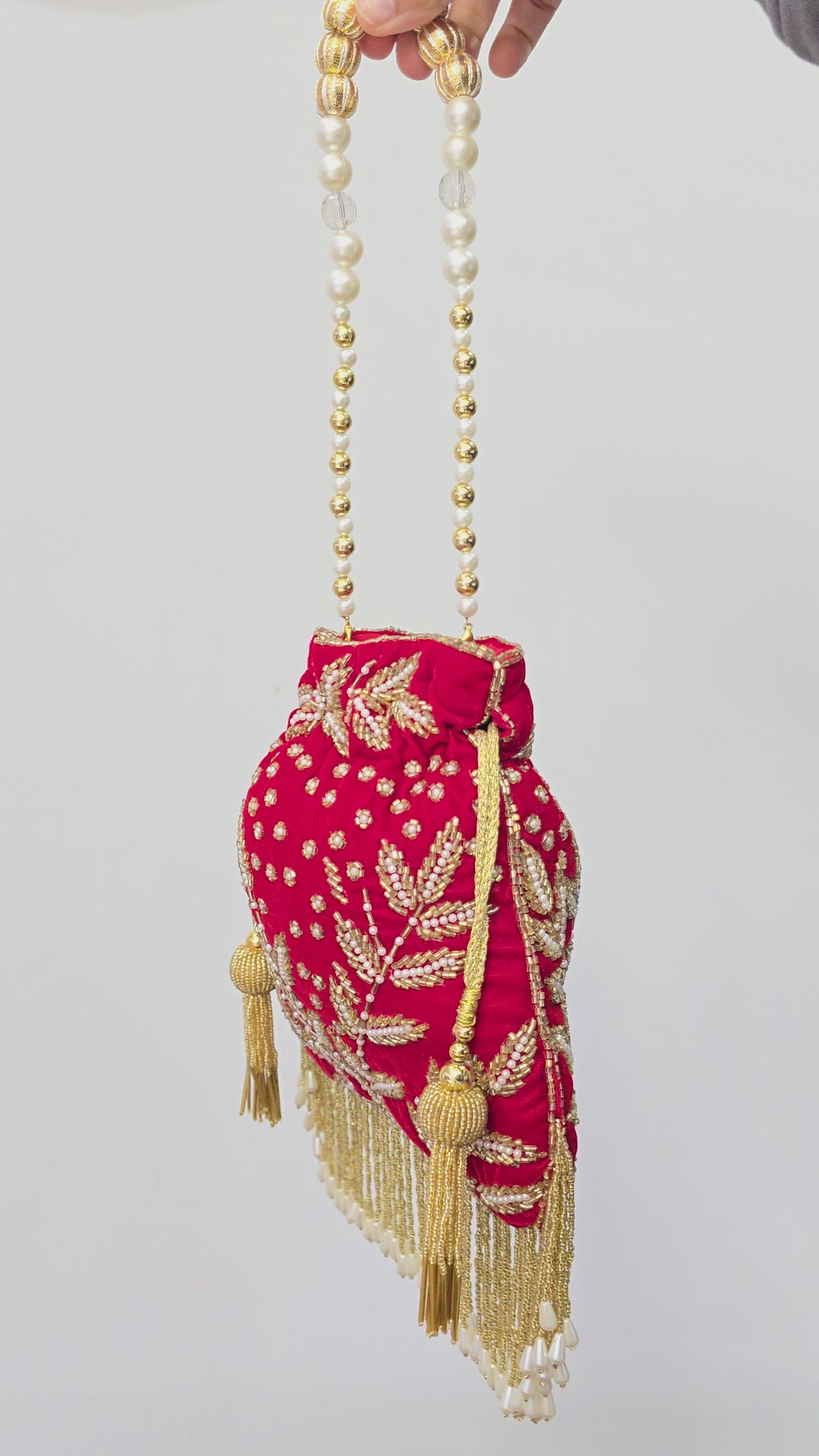 Red hand work potli bag
