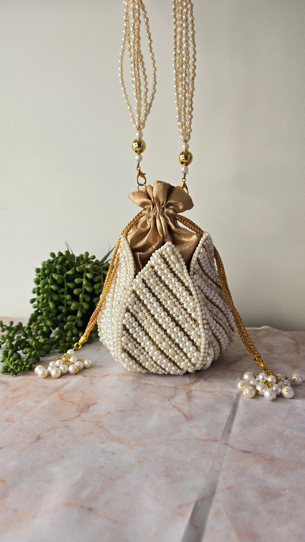 Pearl gold embroidered potli bag