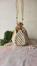 Pearl gold embroidered potli bag
