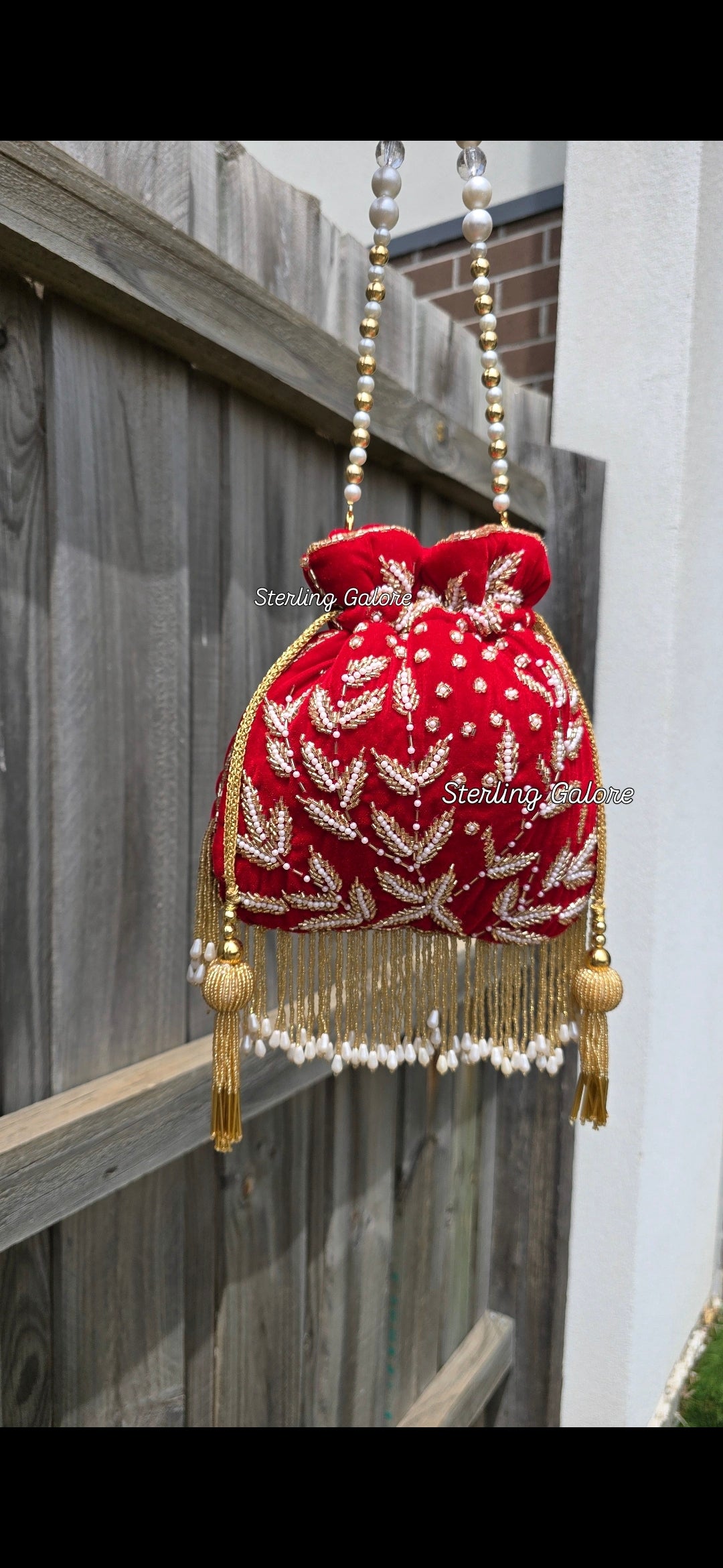 Red hand work potli bag